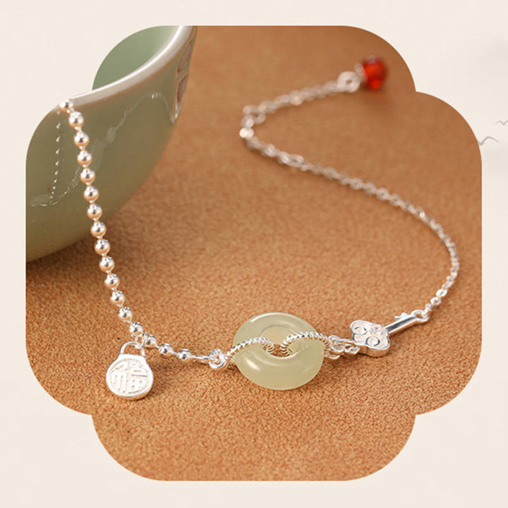Bracciale con catena portafortuna in argento sterling 925 con fibbia della pace in giada Hetian e carattere Fu Buddha Stones