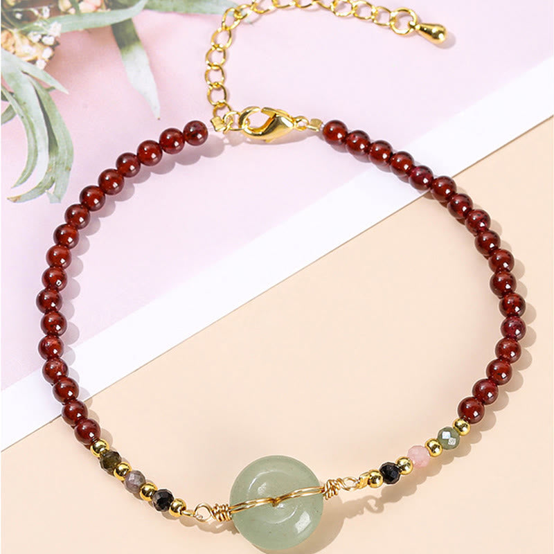 Braccialetto di perline con fibbia della pace in granato naturale Buddha Stones