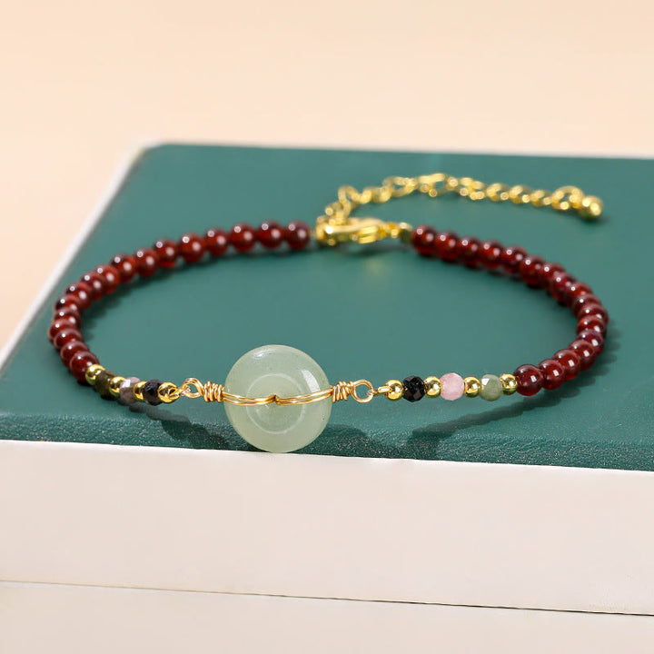 Braccialetto di perline con fibbia della pace in granato naturale Buddha Stones