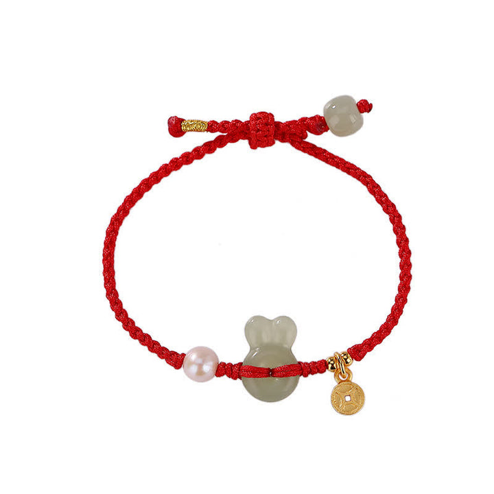 Braccialetto in corda rossa con moneta di rame e giada di Hetian dell'anno del coniglio in argento sterling 925