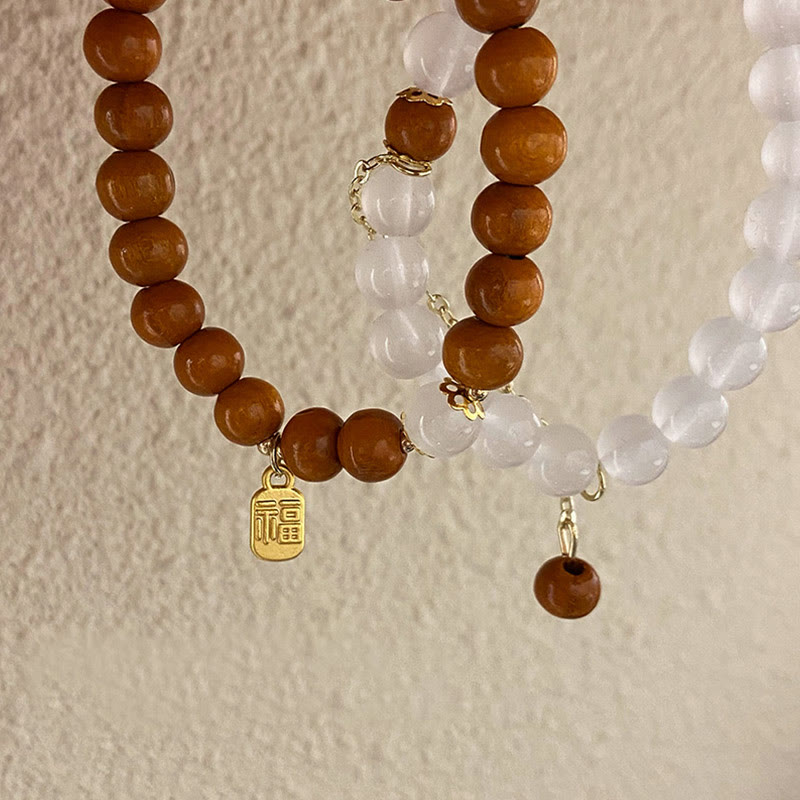Braccialetto di protezione con ciondolo a forma di carattere Fu con occhio di gatto Buddha Stones in legno di sandalo