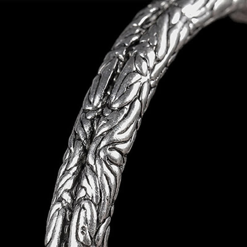 Bracciale rigido con polsino con motivo a drago inciso e bilanciamento