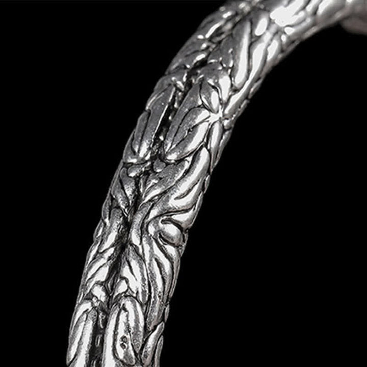 Bracciale rigido con polsino con motivo a drago inciso e bilanciamento