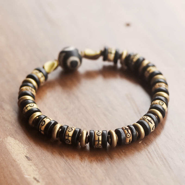 Braccialetto di forza in perline di osso tibetano e legno di ebano con Buddha Stones