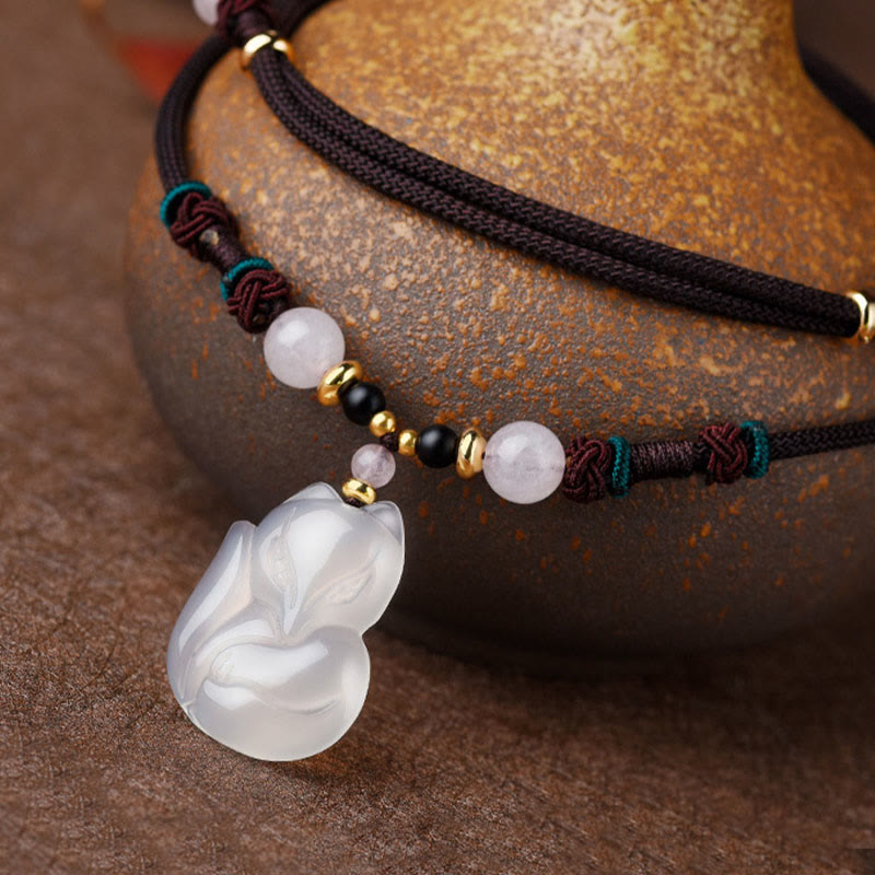 Collana con ciondolo in corda dell'armonia con perline di cristallo rosa di volpe e calcedonio Buddha Stones