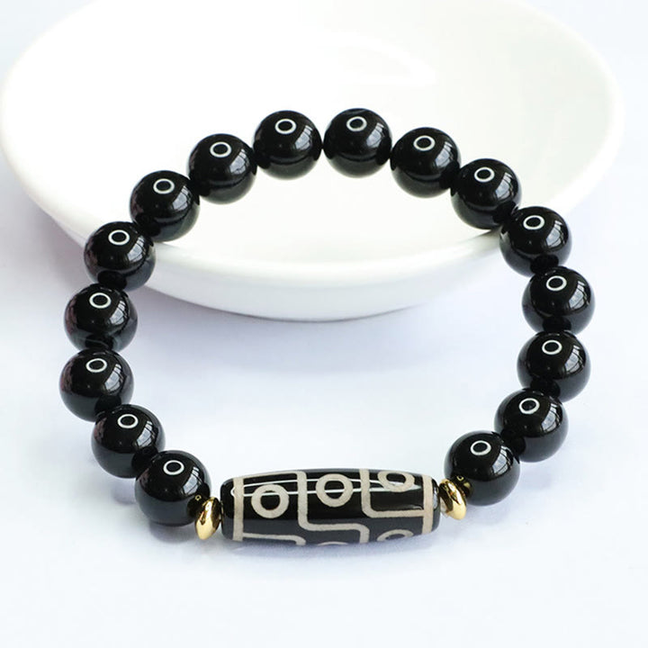 Braccialetto di potere in onice nero con perline Dzi tibetane a nove occhi Buddha Stones