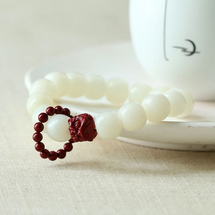 Buddha Stones Semi di Bodhi naturale Cinabro Leone danzante Charm Saggezza Armonia Polso Mala