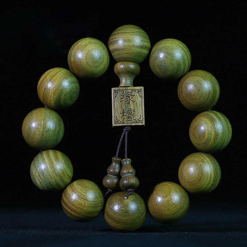 Braccialetto di cura in legno di sandalo verde tibetano Buddha Stones