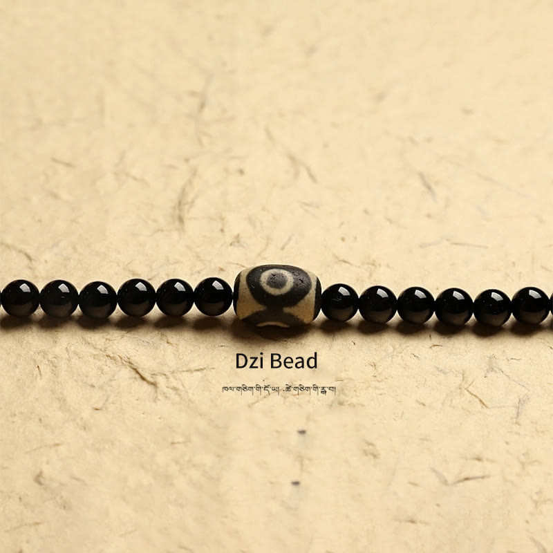 Buddha Stones Tibetano 108 Mala Beads Onice Nero Tre Occhi Dzi Beads Bracciale di Protezione