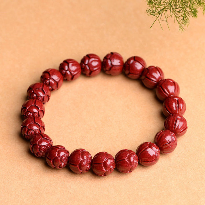 Braccialetto di benedizione del loto con motivo a fregi in cinabro naturale Om Mani Padme Hum Buddha Stones
