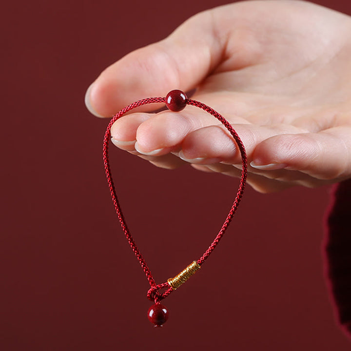 Braccialetto di corda rossa con benedizione in agata rossa naturale e cinabro Buddha Stones