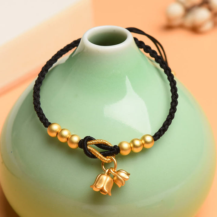 Bracciale intrecciato con ciondolo a forma di fiore di mughetto fatto a mano con Buddha Stones e protezione dalla fortuna
