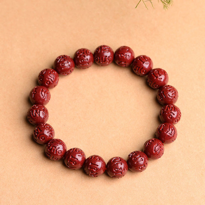Braccialetto di benedizione del loto con motivo a fregi in cinabro naturale Om Mani Padme Hum Buddha Stones