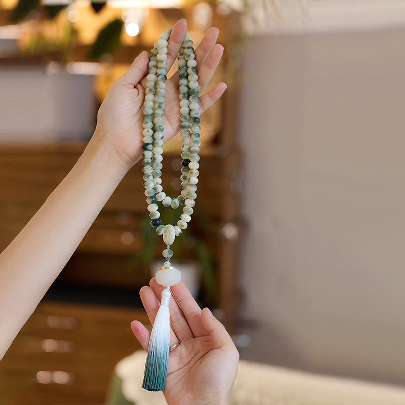 Buddha Stones naturali 108 perle Mala Bodhi Seed Lotus inciso braccialetto di saggezza nappa