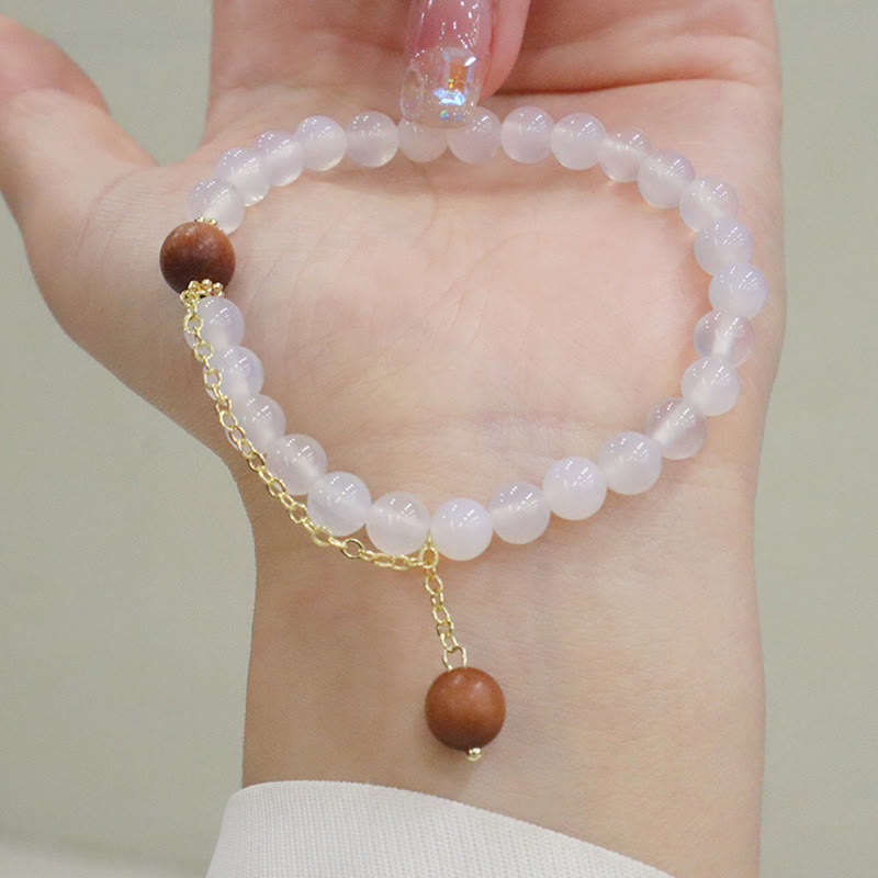 Braccialetto di protezione con ciondolo a forma di carattere Fu con occhio di gatto Buddha Stones in legno di sandalo