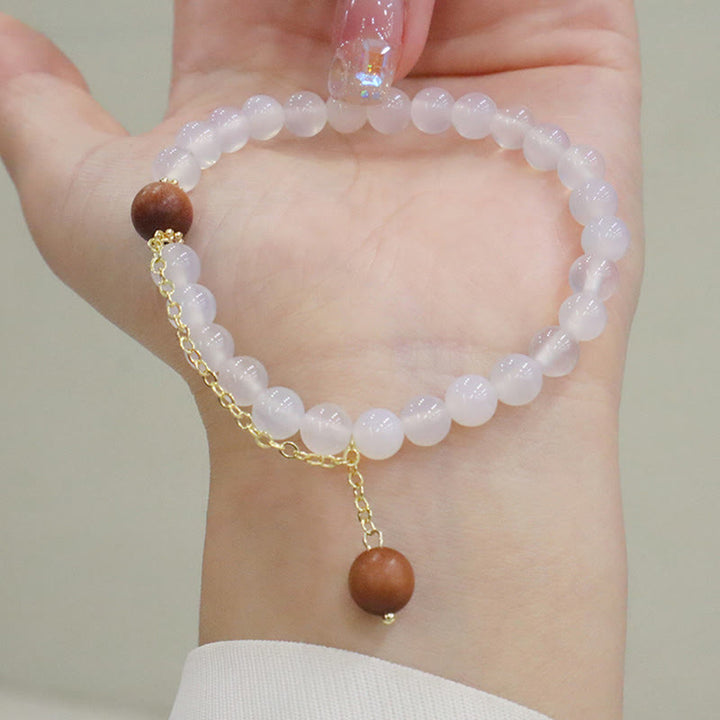 Braccialetto di protezione con ciondolo a forma di carattere Fu con occhio di gatto Buddha Stones in legno di sandalo