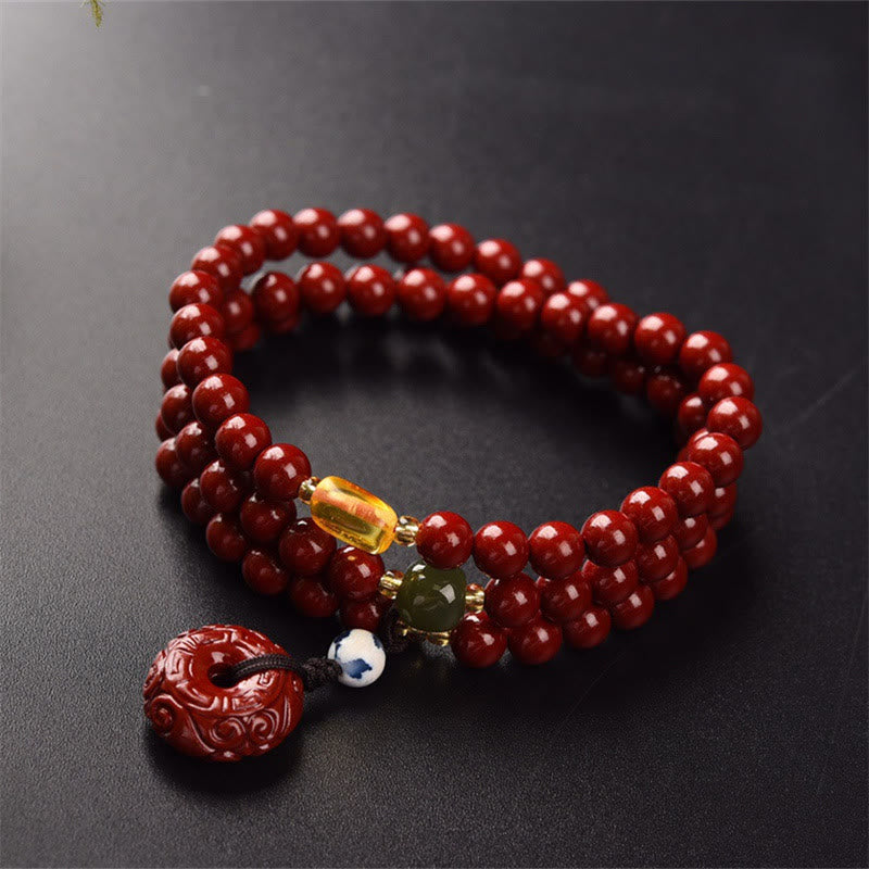 Braccialetto di benedizione a triplo giro con fibbia della pace in cinabro tibetano Buddha Stones Mala