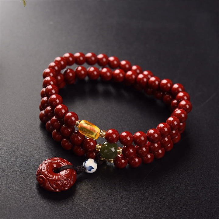 Braccialetto di benedizione a triplo giro con fibbia della pace in cinabro tibetano Buddha Stones Mala