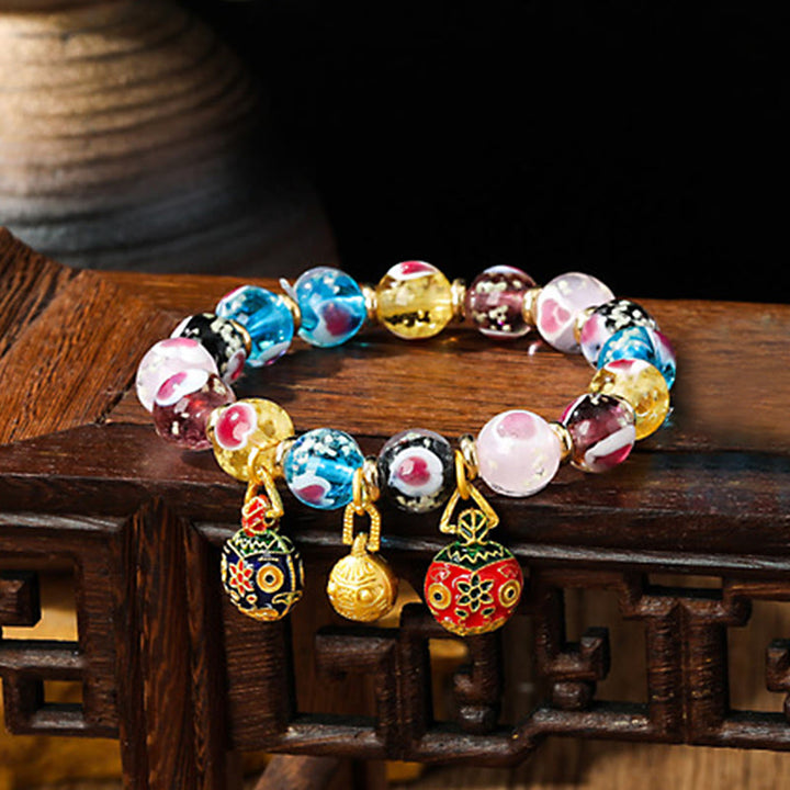 Braccialetto di perline di vetro fluorescente luminoso Liuli con cuore rosa della famiglia di bestie che ingoiano Buddha Stones