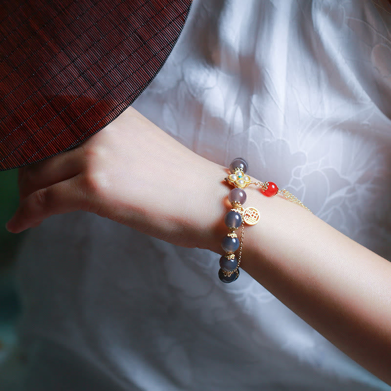 Braccialetto di equilibrio con nappa di perle di carattere Fu in agata grigia naturale Buddha Stones