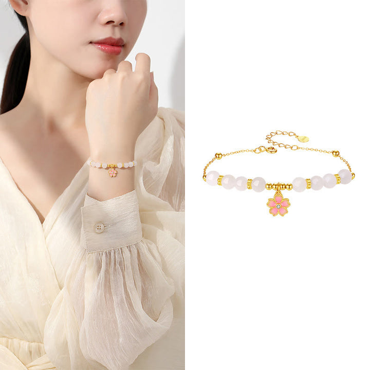 Braccialetto di protezione in giada bianca Hetian con fiori di ciliegio in argento sterling 925 Buddha Stones
