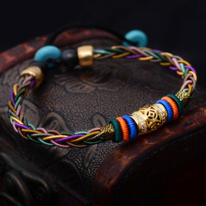 Braccialetto di corda intrecciata con moneta di rame con nodo a otto fili fatto a mano in pietre Buddha Stones tibetano - image 1