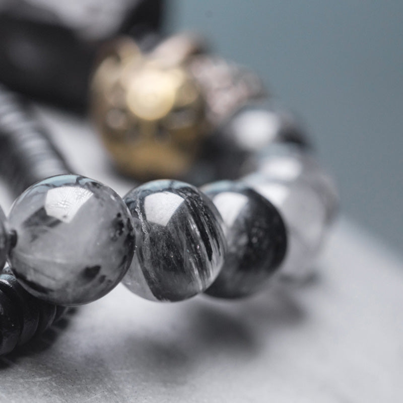 Braccialetto di coppia della saggezza del rame del legno di ebano del quarzo rutilato nero Buddha Stones