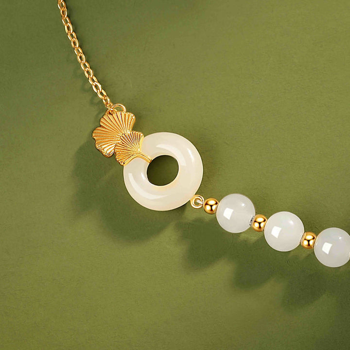 Braccialetto della fortuna con foglia di ginkgo e fibbia della pace in argento sterling 925 con Buddha Stones e giada bianca Hetian