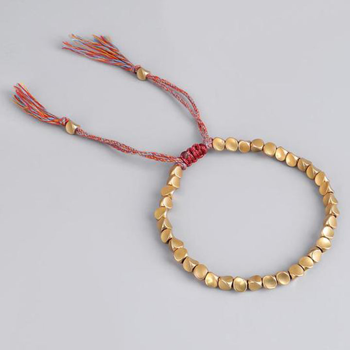 Braccialetto portafortuna con perline di rame tibetano Buddha Stones