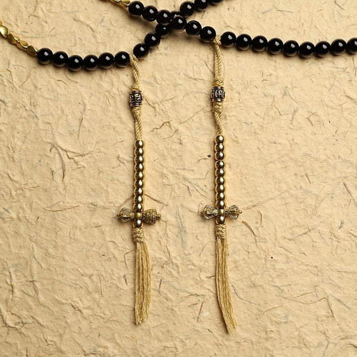 Buddha Stones Tibetano 108 Mala Beads Onice Nero Tre Occhi Dzi Beads Bracciale di Protezione