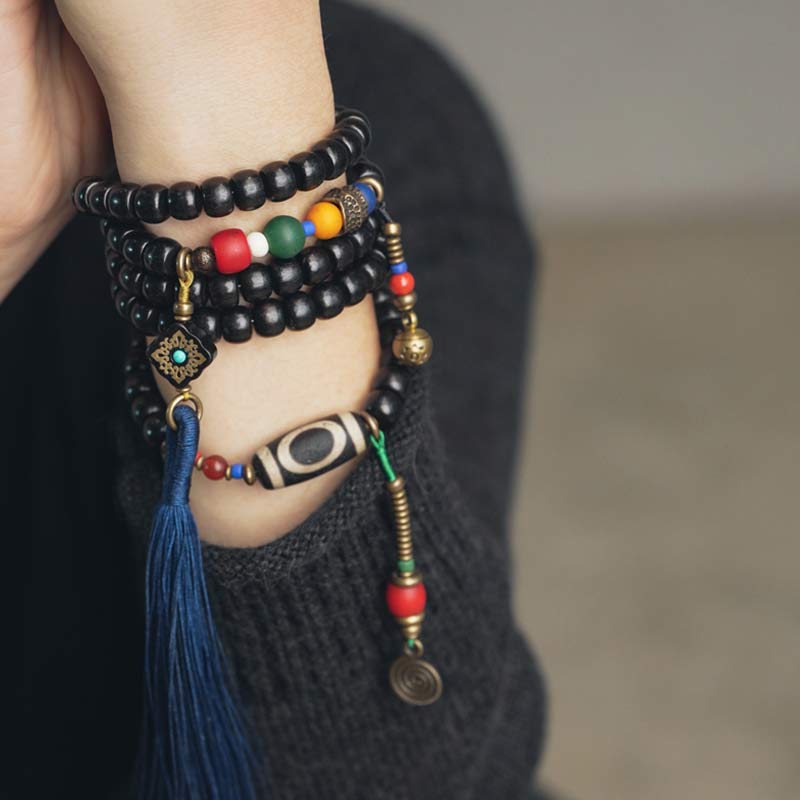 Buddha Stones 108 Perline Mala Legno di Ebano Dzi Perline Rame Braccialetto con Nappa