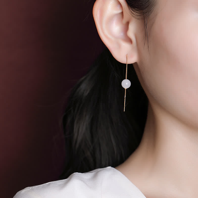 Orecchini pendenti in argento sterling 925 con perline di giada bianca e simbolo della felicità