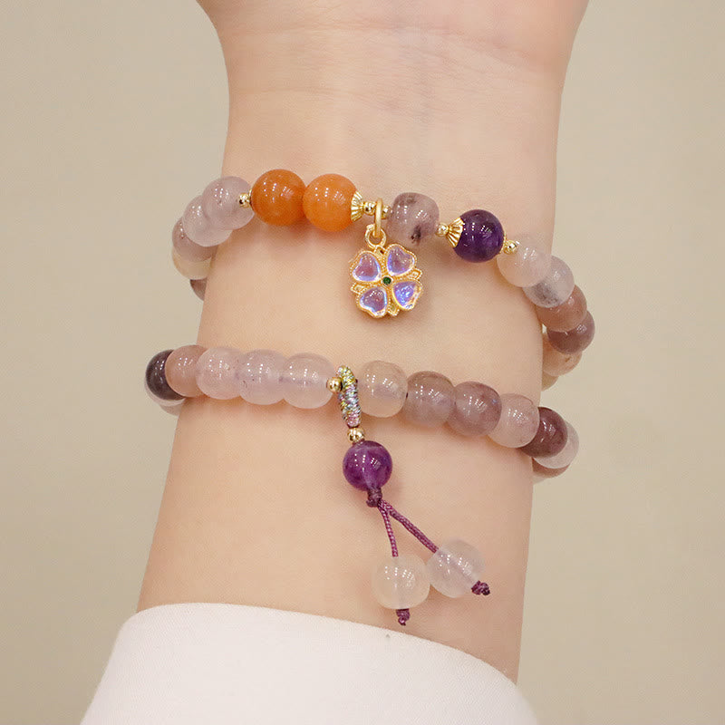 Braccialetto di perline con ciondolo a forma di fiore viola dorato naturale di seta Buddha Stones