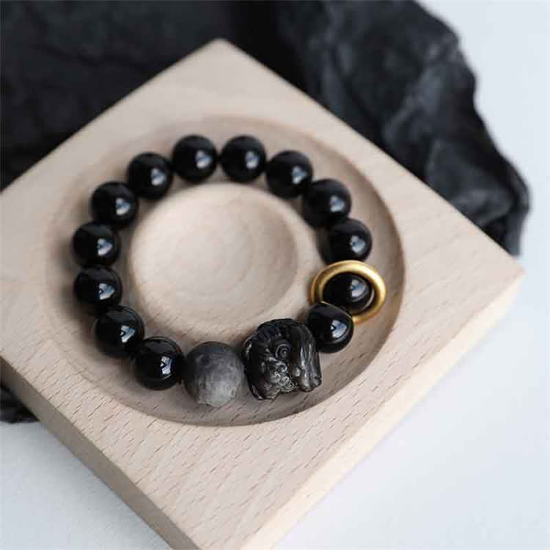 Bracciale in ossidiana nera, argento lucido e forza del leone
