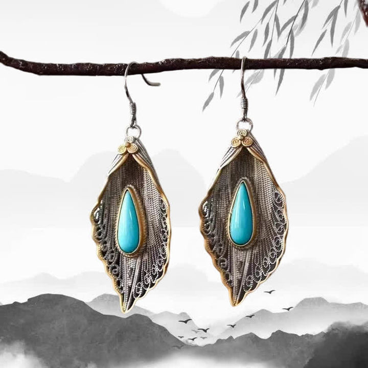 Orecchini pendenti con motivo a foglia di Bodhi in argento sterling 925 con Buddha Stones e turchese