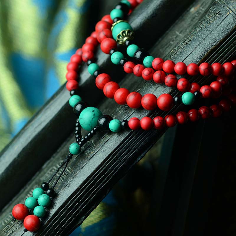Braccialetto di protezione con perline di turchese rosso e onice nero Buddha Stones