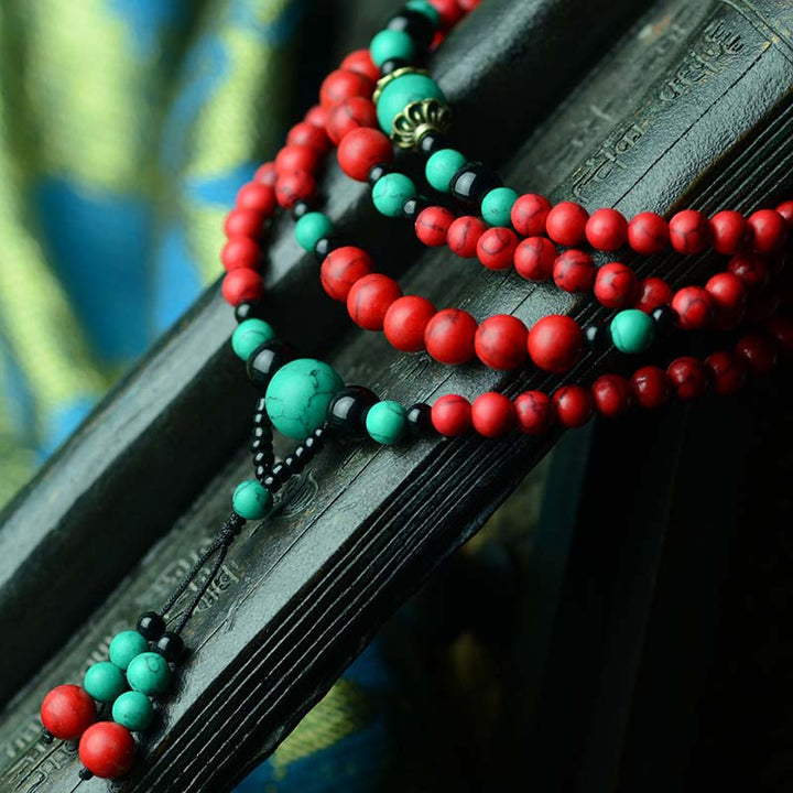 Braccialetto di protezione con perline di turchese rosso e onice nero Buddha Stones
