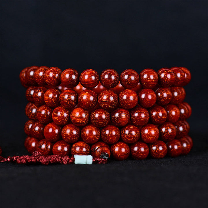 Braccialetto di equilibrio in legno di sandalo rosso con foglia piccola tibetana Buddha Stones