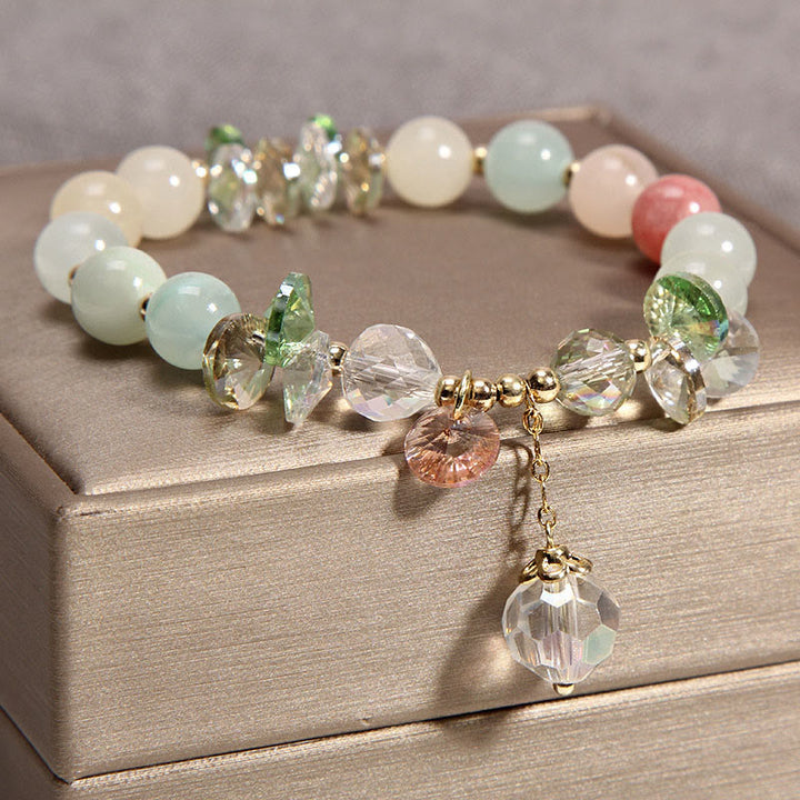 Braccialetto con ciondolo di pace in cristallo rosa con occhio di gatto Buddha Stones