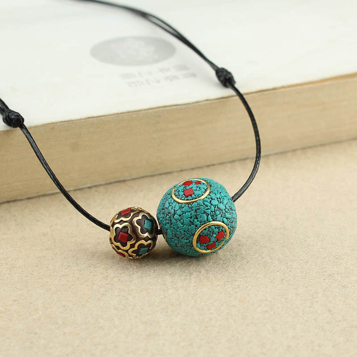 Collana con ciondolo con doppia perla turchese tibetana Buddha Stones, protezione e forza