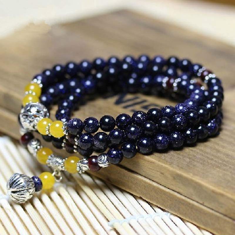 Braccialetto Mala con ciondolo di ricchezza in arenaria blu Buddha Stones