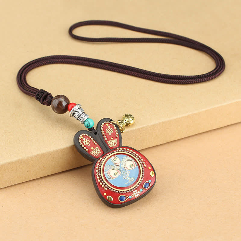 Collana pendente Thangka con cinque divinità della ricchezza in ebano tibetano