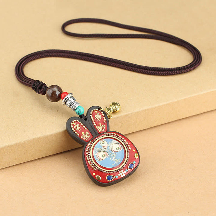 Collana pendente Thangka con cinque divinità della ricchezza in ebano tibetano