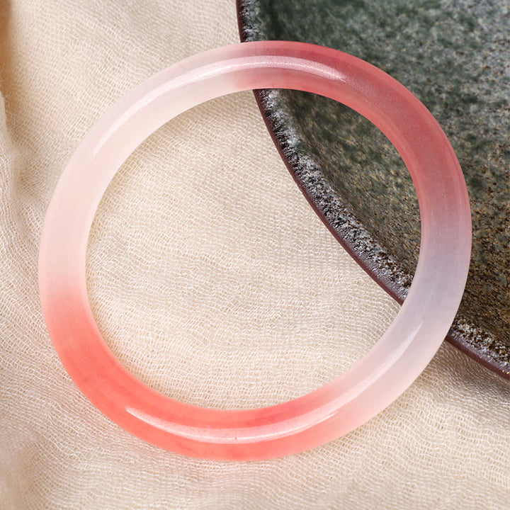 Braccialetto di giada rosa dorato e seta Buddha Stones Wealth