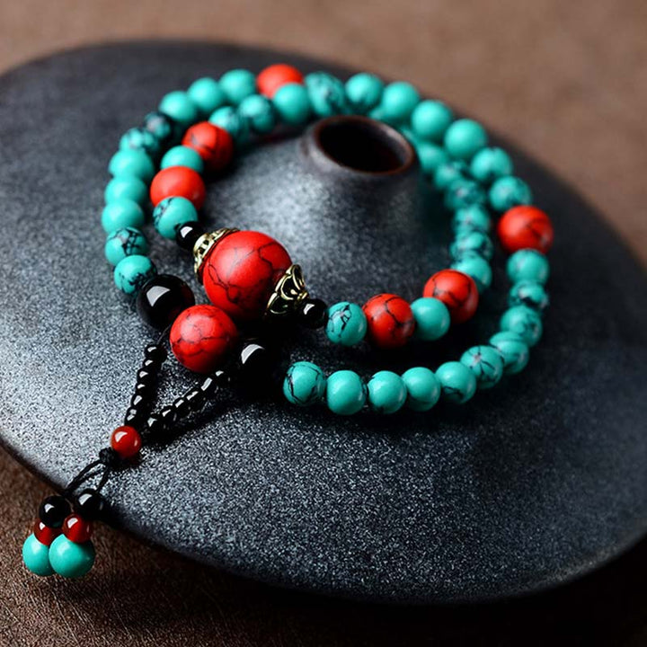 Braccialetto di protezione con perline di turchese rosso e onice nero Buddha Stones