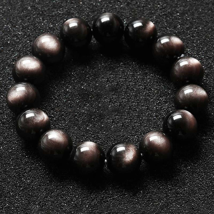Braccialetto di protezione lenitiva in ossidiana lucida d'argento naturale Buddha Stones