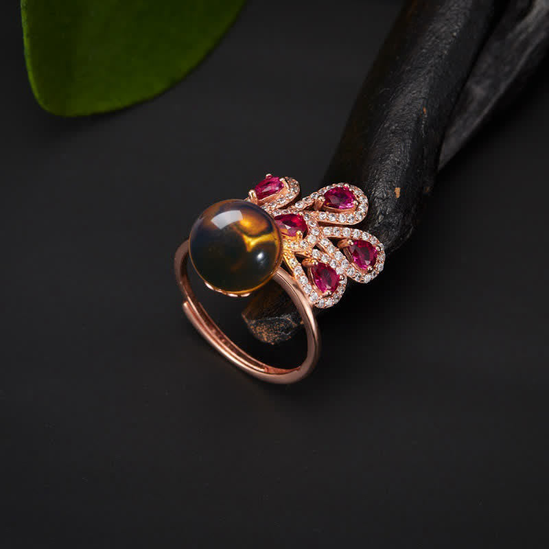 Collana con ciondolo e anello in ambra con pavone e amore e fortuna