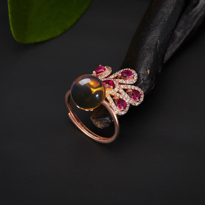 Collana con ciondolo e anello in ambra con pavone e amore e fortuna