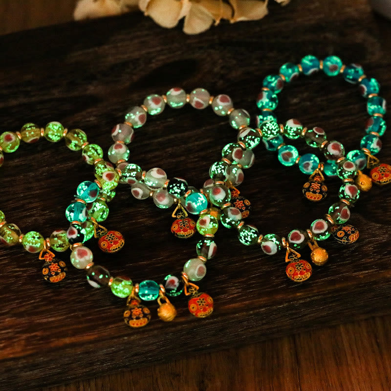 Braccialetto di perline di vetro fluorescente luminoso Liuli con cuore rosa della famiglia di bestie che ingoiano Buddha Stones
