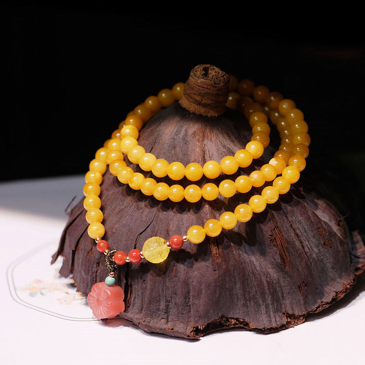 Collana con ciondolo a forma di fiore in ambra curativa e bilanciata